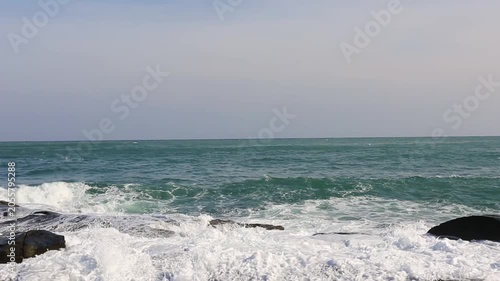 Huge waves crashing against the rocks。Stone Park Scenic Area, Hainan, China