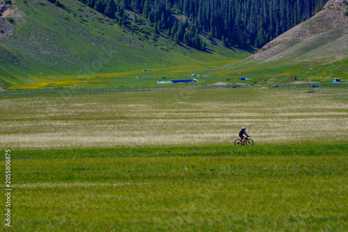 Cyclists on the road of Sailimu Lake