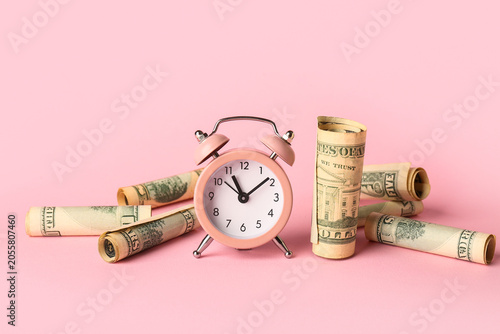 Alarm clock with money on p...