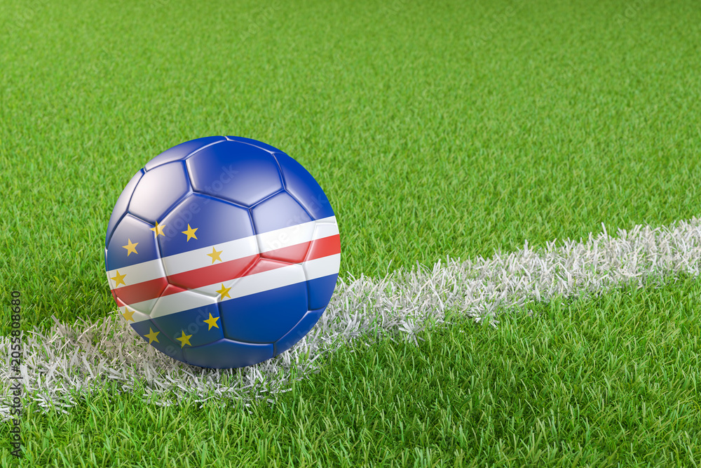 Naklejka premium Football / soccer ball with a flag overlay of Cape Verde on a football pitch background. International match and national team of Cape Verde concept