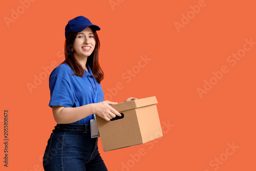 Smiling young delivery woma...