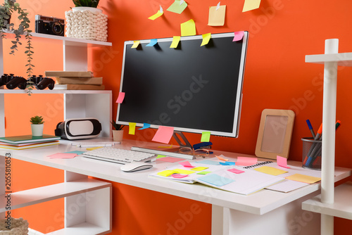 Workplace with blank comput...