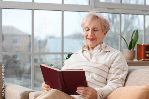 Beautiful senior woman read...
