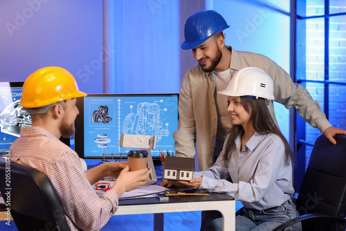 Group of engineers working ...