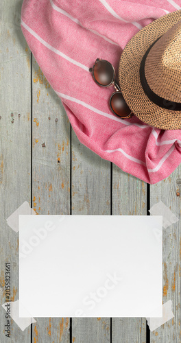 Summer Holiday Vacation Trip Mockup Concept Wallpaper with White Blank Free Space Paper Sheet with Adhesive Tape on Wooden Surface. File with Clipping Path.