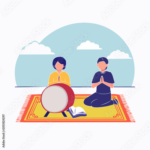 Two people praying with a drum and book