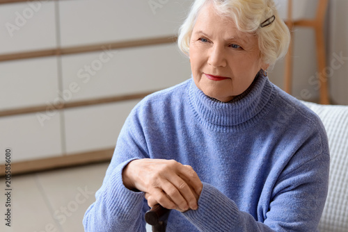 Thoughtful senior woman wit...