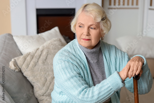 Thoughtful senior woman wit...