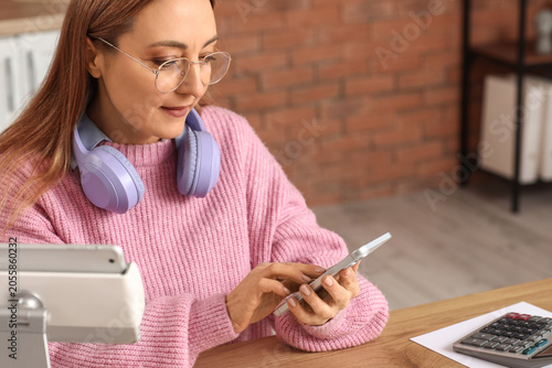 Woman in pink sweater with ...
