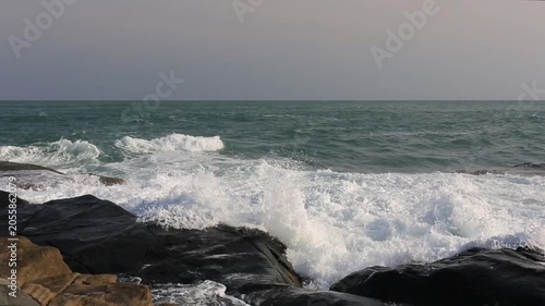 The scenery of huge waves crashing against the rocks