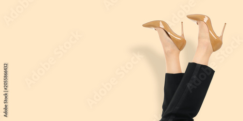 Bild auf Leinwand Woman showcases trendy high heel shoes with legs visible