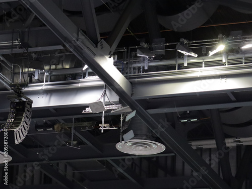 Ceiling of a college arena.  Guessing the round white thing is part of hvac.
