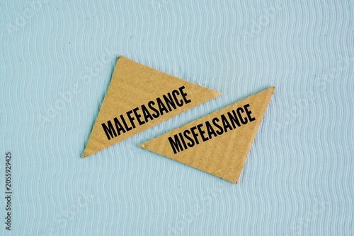 Photos Box paper with the words Malfeasance and Misfeasance