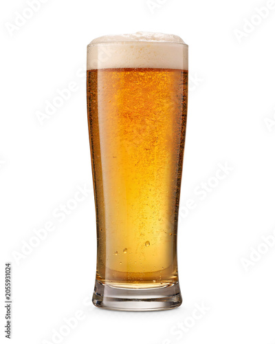 Tall glass of golden beer with frothy head and bubbles isolated on transparent background