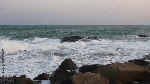 The scenery of huge waves crashing against the rocks