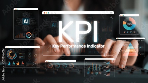 Fotografie Hands typing on a keyboard with multiple screens displaying KPI metrics and data visualizations in a modern digital workspace environment for performance analysis