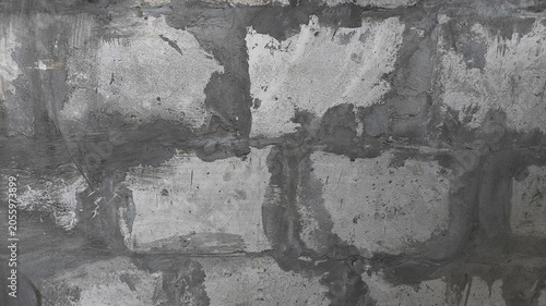 Bild auf Leinwand Aged brickwork surface with deteriorating gray plaster and visible fracture patterns, offering a realistic architectural texture suitable for creative backdrops, banners, and graphic resources