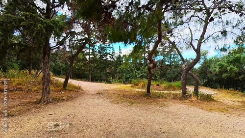 Philopappou Hill in Athens, Greece park point of view pov hiking trail walking in spring summer with mediterranean landscape