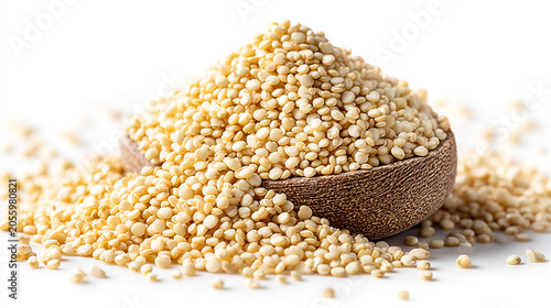 Heap of raw quinoa grains spilled from a wooden bowl with nutrition, superfood
