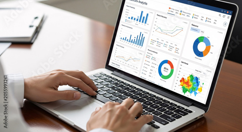 Persons Hands Typing on a Laptop, Analyzing a Healthcare Analytics Dashboard with Various Charts and Graphs