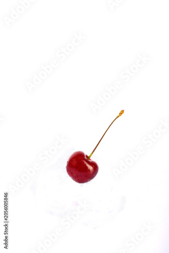 cherry berry with water drops on a white background