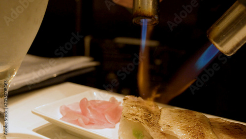 Obraz na płótnie Chef Searing Aburi Sushi with Blue Flame Blowtorches in Kanazawa