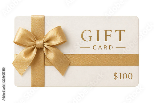 A gold ribbon tied on a white gift card with 