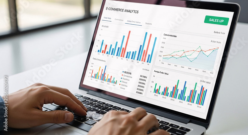 Close up of Hands Typing on a Laptop Showing E commerce Analytics Dashboard with Sales Graphs