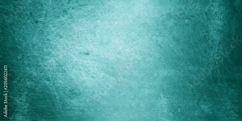Foto Textured teal background with subtle scratches, evoking a sense of industrial wear or abstract art