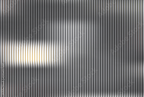 Blurry abstract light patterns on a gray surface are shown closely