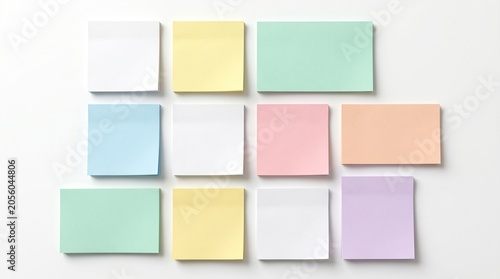 Colorful sticky notes arranged in rows on a plain surface