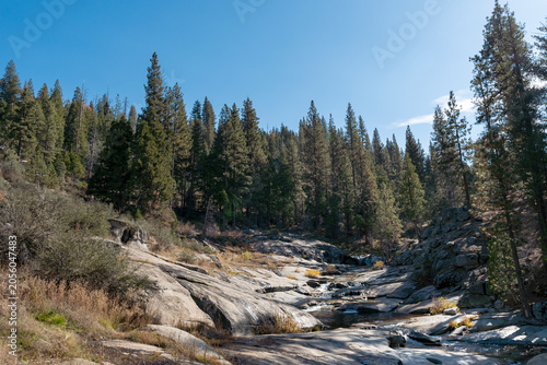 Rocky Mountain Creek Flowing Over Granite Slabs in Sierra Nevada California