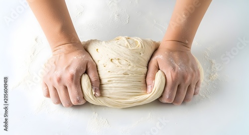 Hands kneading fresh white dough on clean flat surface minimalist baking preparation