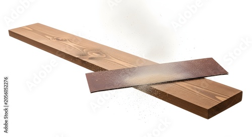 Wooden plank being sanded with sandpaper on white background minimalist texture