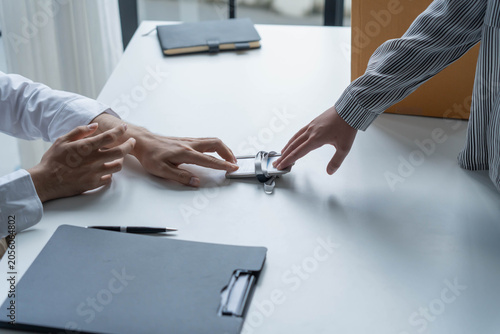 Schilderij op canvas Asian office worker informs HR of resignation