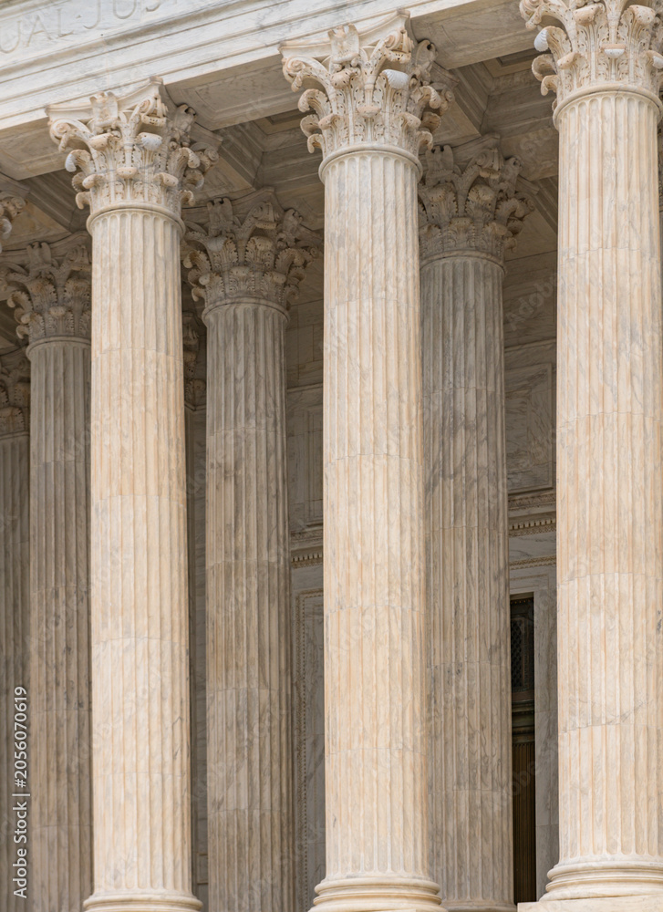 Obraz premium Columns marble fluted Tall vertical. Columns architectural symmetry repetition. Columns decorative capitals ornament elements. Columns classical facade.