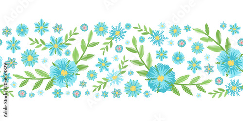 Seamless horizontal border with embroidery blue flowers and green leaves on white background. Vector design.