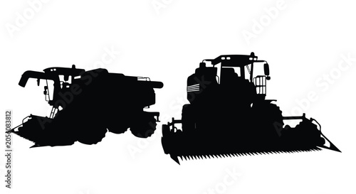 silhouette of tractor and harvester machines in field
