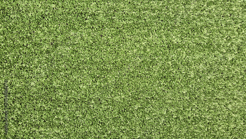 Cuadro en lienzo A top-down, full-frame shot showcases a dense, uniform texture of bright green artificial turf or synthetic grass blades