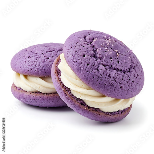 Isolated sweet purple whoopie pies with rich creamy white filling, tasty homemade dessert treat 
