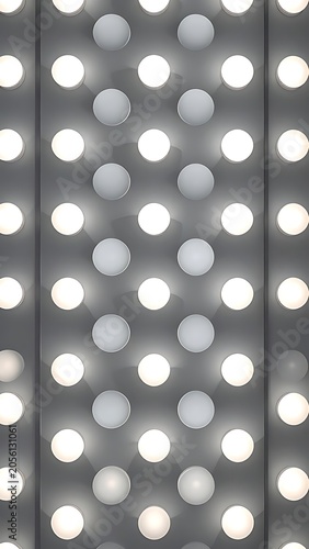 A gray background with rows of white and gray circles