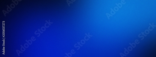 Abstract deep blue blurred gradient background with grainy texture.