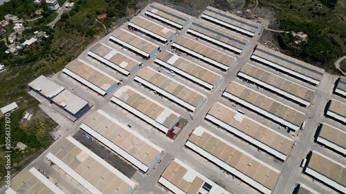 Aerial drone footage of a large industrial warehouse and logistics park