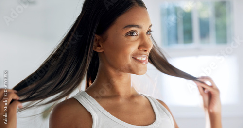 Canvastavla Smile, woman and touch in bathroom for haircare, beauty and healthy shine for keratin treatment