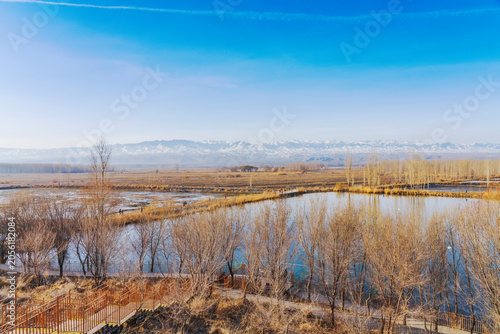 The natural beauty of the Tianshan Mountains and Swan Lake in winter in Xinjiang, China on March 3, 2023