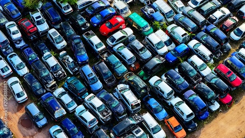 Fotografie Dense Car Scrapyard Packed with Scrapped and Damaged Vehicles