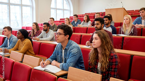 Diverse group of students attentively listening in a university lecture hall