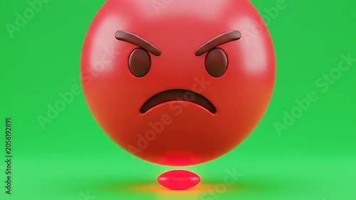 A three dimensional red sphere showing an angry facial expression on green background