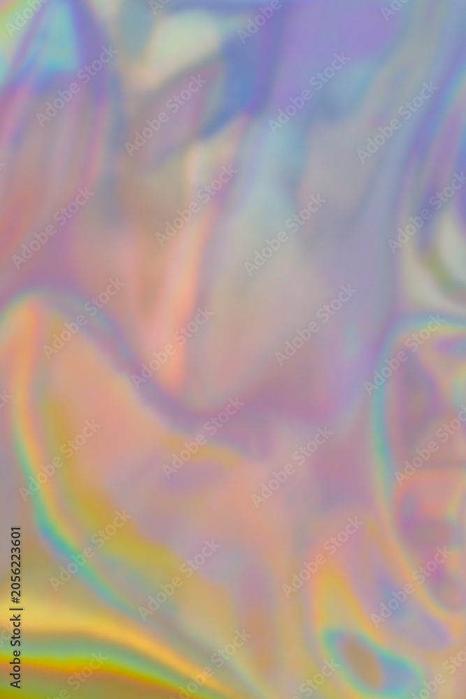 Fototapeta premium Colorful light reflections create a blurred pattern on a surface during daytime