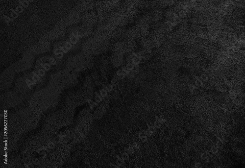 Close up black tire marks on cement floor.